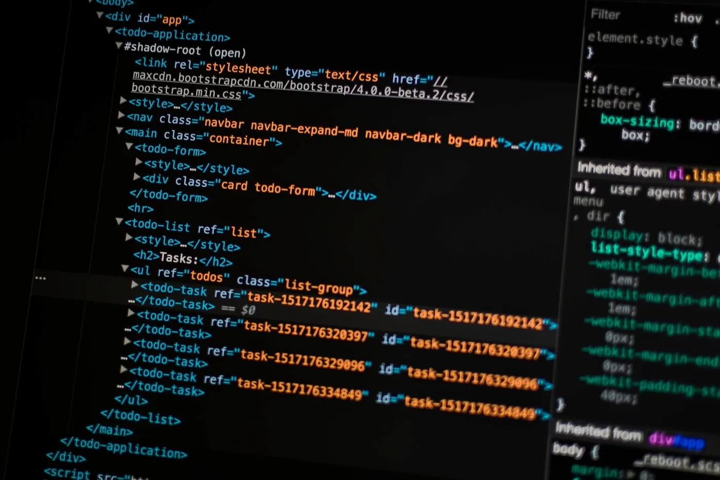 Dark computer screens displaying API and application code