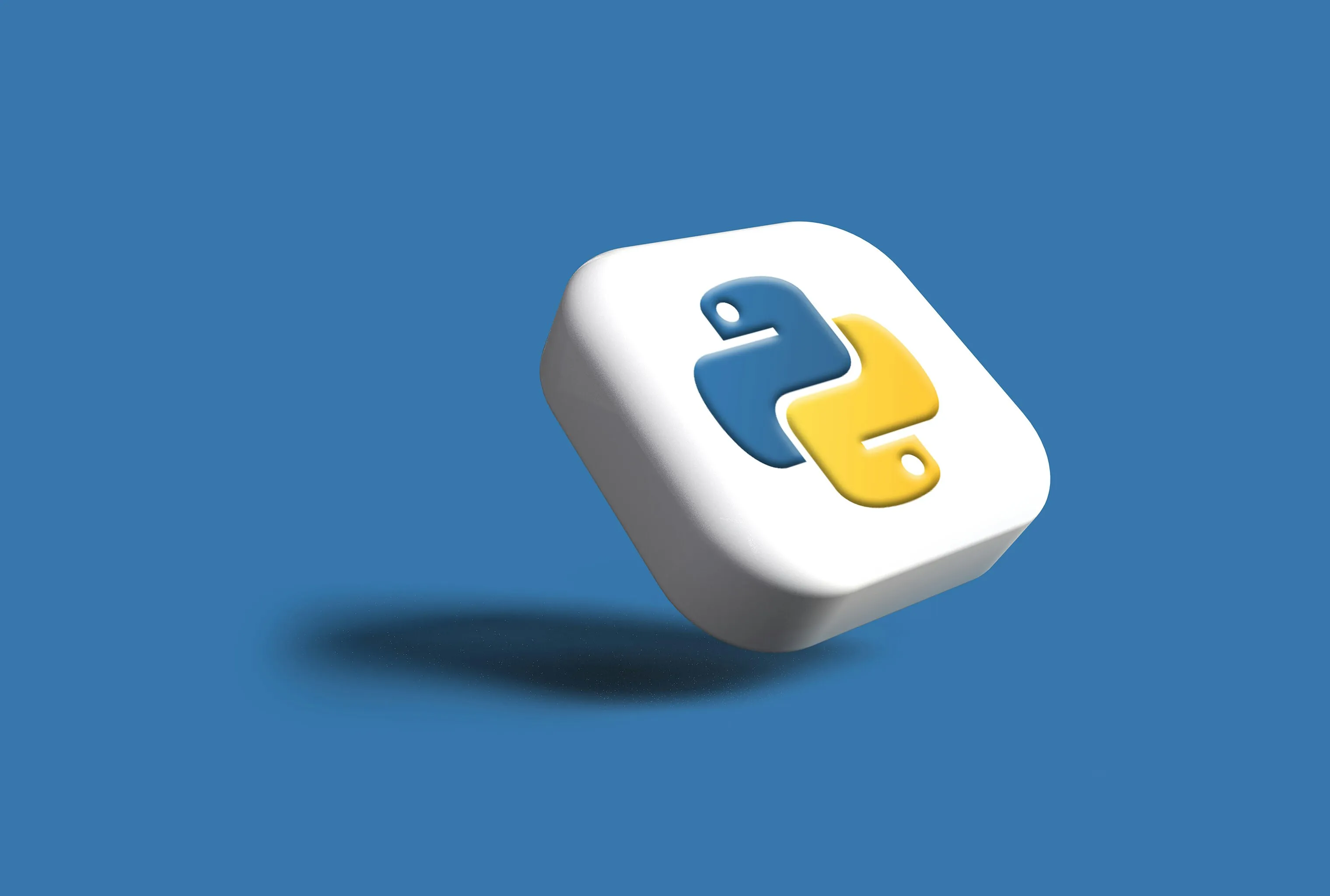 A white rounded tile with the Python logo, tilted and floating above a blue surface